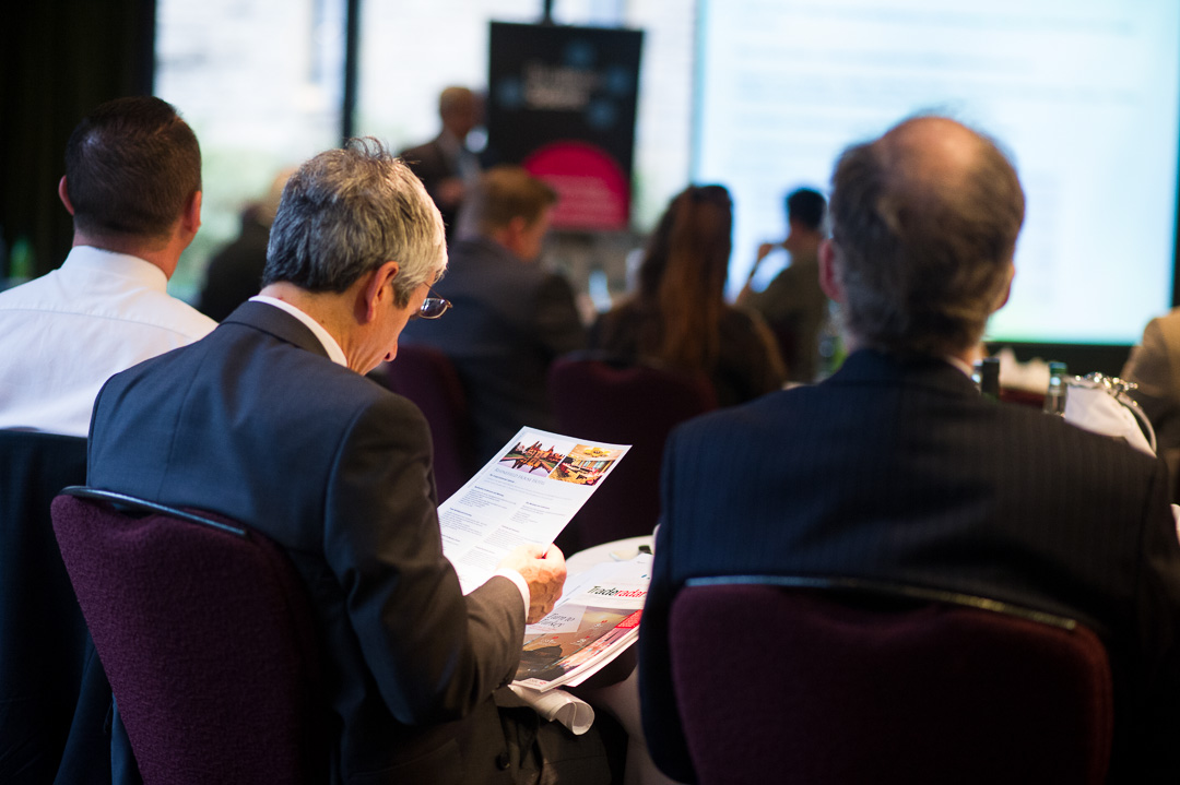 Conference photographer creating documentary images